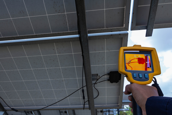 Thermoscan(thermal image camera), Industrial equipment used for checking the internal temperature of the machine for preventive maintenance, This is checking Junction box of solar panel.